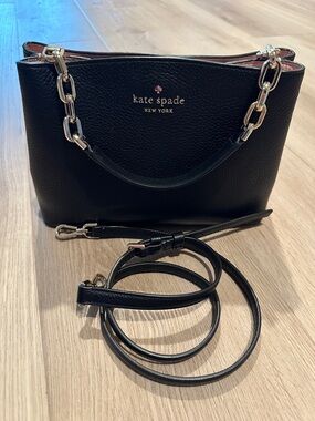 kate spade “Bailey” black pebbled leather crossbody bag with gold chain accents